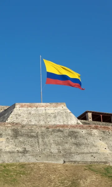 a colombian flag is streaming in the wind over the 2026 01 05 00 16 37 utc e1770654523548