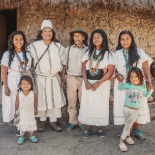 an arhuaca family poses in front of their house in 2026 01 07 06 24 55 utc 1 scaled e1770227496125