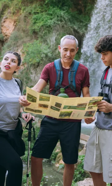 family hiking exploring nature with map and binocu 2026 01 11 11 13 06 utc e1770655644346