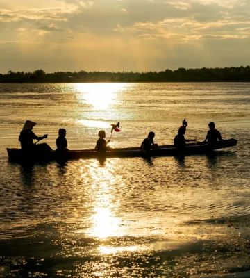 silhouette of man paddle the boat that carry group 2026 01 08 06 36 25 utc e1770654500487