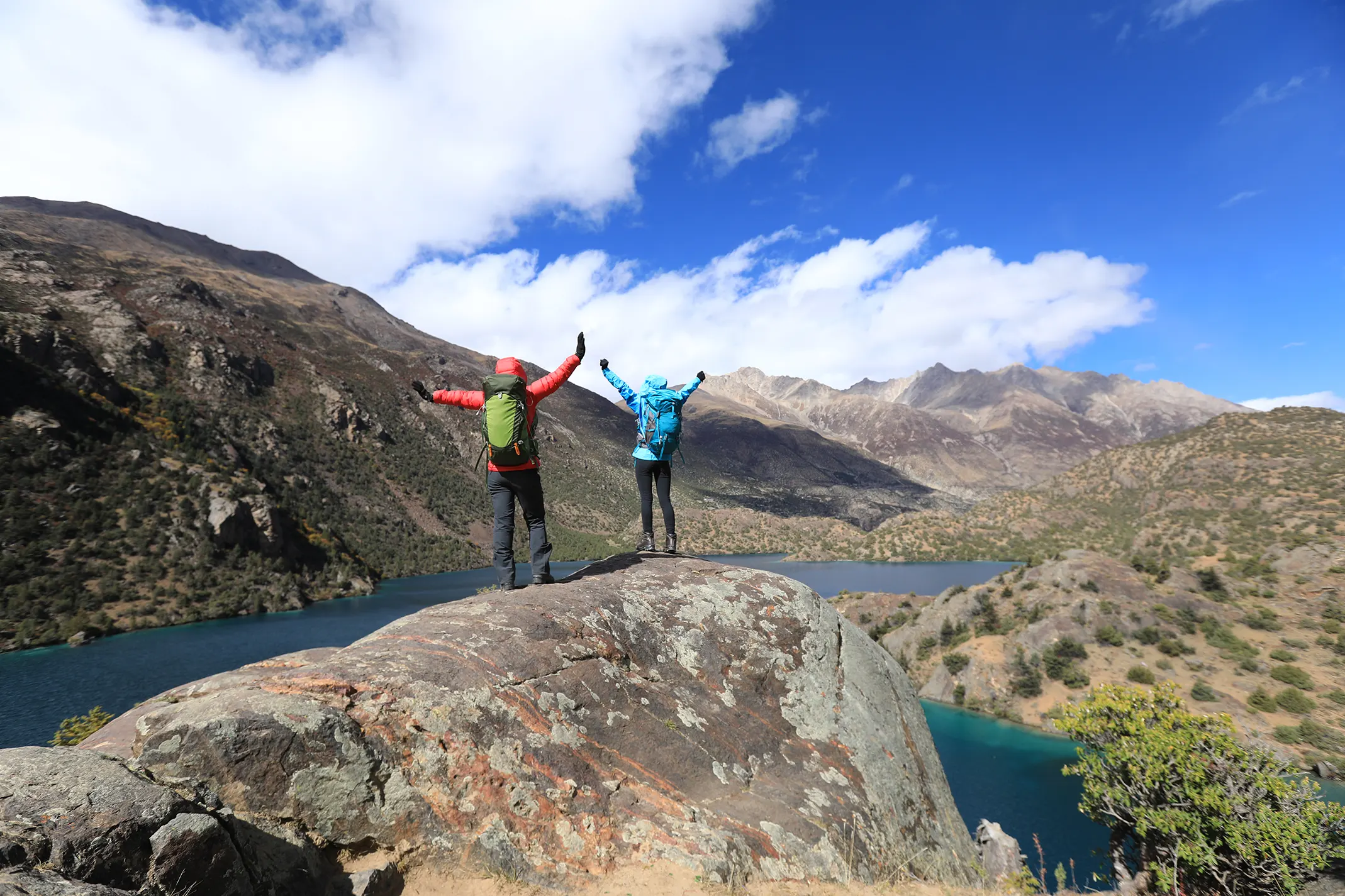 two women backpackers hiking in beautiful winter 2026 01 07 02 11 49 utc